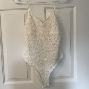 TOPSHOP lace-style bodysuit.